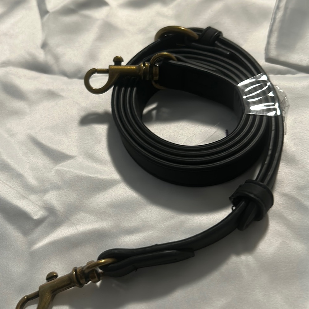 Black purse strap unused adjustable length nwot.